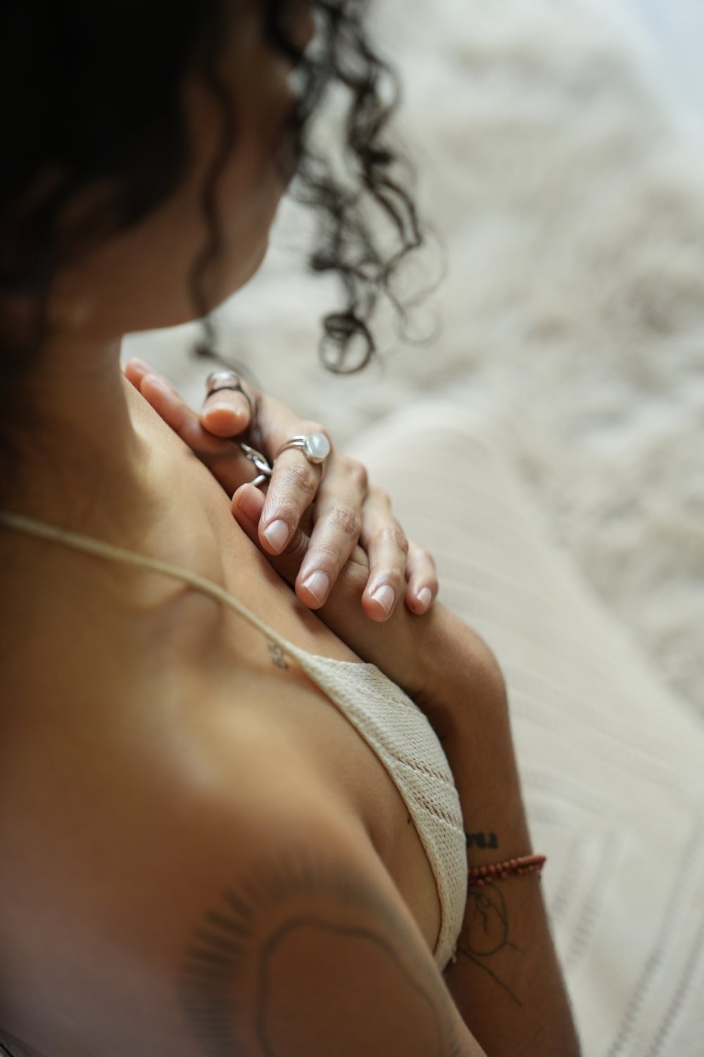 A woman resting with her hand at her heart